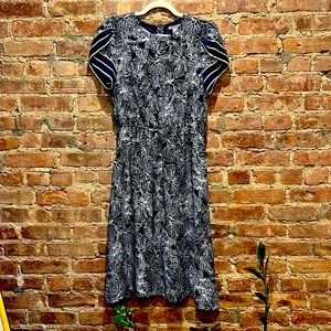 Navy blue dress white flower pattern.  Beautiful short sleeves.